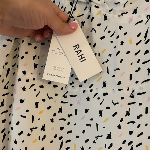 Elegant White and Black Polka Dot Mini Dress - Picture 7 of 8